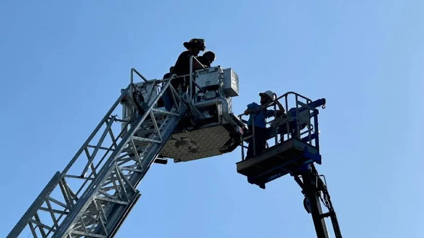 PHOTOS: Colonial Heights firefighters save workers trapped on stories-high lift