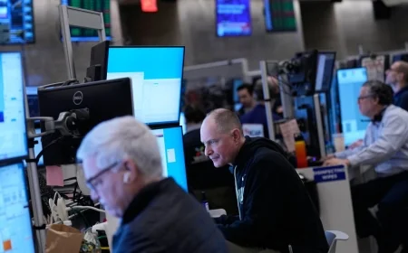 Stocks of credit card companies slump as Wall Street overall drifts in mixed trading