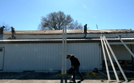 Church members rebuild Yoder’s Market tin roof after it blew off in storm