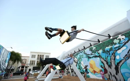 Try out the Musical Swings Public Art Installation on lawn of the Williamsburg Community Building