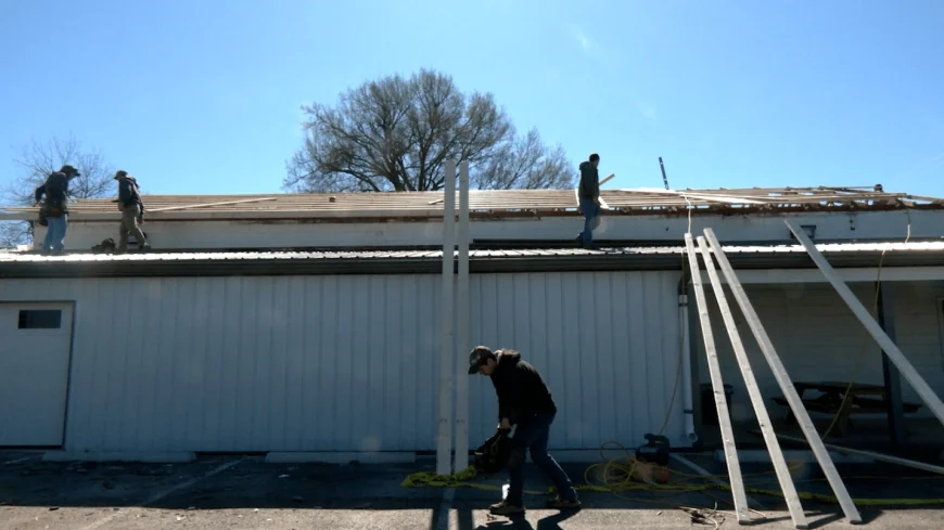 Church members rebuild Yoder’s Market tin roof after it blew off in storm